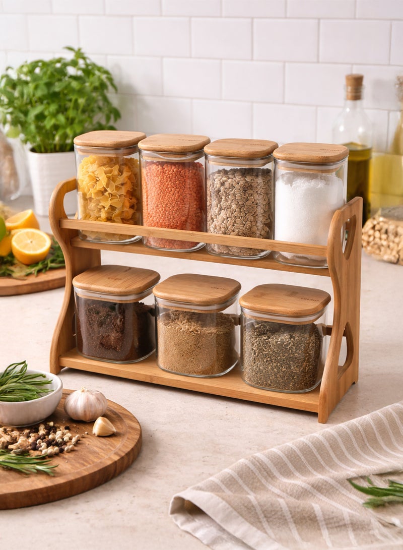 توشيونيكس طقم برطمانات تخزين زجاجية محكمة الإغلاق من البوروسيليكات مكون من 7 قطع مع منظم رفوف من الخيزران من طبقتين - علب تخزين شفافة للتوابل والمكسرات والفاصوليا والمعكرونة والأطعمة الجافة - أغطية من الخيزران محكمة الإغلاق بالسيليكون - Image 1